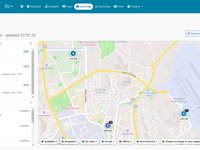 A live map of vehicles with a list of trips under way and their ETAs, and a legend of vehicle states.