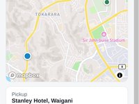 A passenger's phone page showing their vehicle on a map heading to the pickup, with an estimated arrival time, the vehicle and the driver's first name.